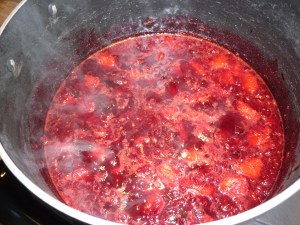 . Add the rind and pulp of 3 medium oranges and 1 cup dried cranberries (Craisins). Cook for 10 minutes.