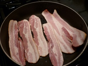 In a large skillet, fry 6 slices of bacon until crisp.