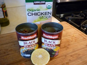 Stir in 1 quart (or liter) of chicken broth, 2 15-oz. cans black beans, drained, and 2 Tbsp lemon juice. Simmer for 45 minutes. Serve.