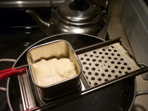 Spaetzle is like pasta, but the batter-like dough is pressed through small holes into salted boiling water. Note, do not let whatever device you are using rest upon the edges of the pot for very long or the device will heat up and the batter will cook as soon as it touches the device. My friend Jo learned this from experience. She had to stop, clean her cheese grater, and begin again. Avoid this type of kitchen crisis by working quickly and don’t allow the spaetzle maker to rest on the rim of the kettle.