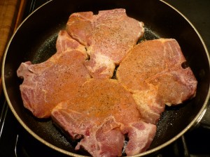 Using same skillet, brown seasoned pork chops. Remove chops from skillet and set aside. Deglaze the skillet with white wine, scraping the crispy bits up from the pan. Let wine simmer and reduce for a few minutes. 