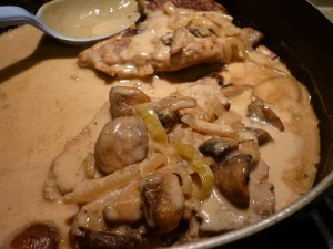 Add pork chops back into skillet and cover with sauce. Serve. 