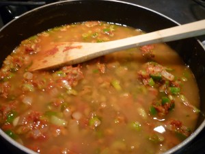 Stir in the tomato paste, followed by the broth and wine. Stir constantly until this mixture thickens.