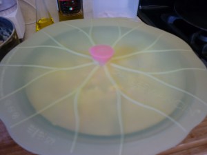 Pour into an ungreased 3-qt. baking dish. I use the same dish to cook the potatoes, mix the casserole, and then bake it. Cover and bake at 350 degrees for 45 minutes. I cover with my cute silicon cover which works in the microwave and the oven and then the dishwasher.