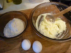 To make the crust, cream ½ cup butter with ½ cup sugar and 1-1/2 tsp. lemon zest. (Out of lemons, I used 1-1/2 tsp. of dried lemon peel.) Add two egg yolks and mix. Stir in 1-1/2 cups flour and 1 tsp. baking powder.