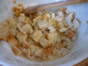 Melt butter into milk and pour over bread. Let sit 15 minutes.