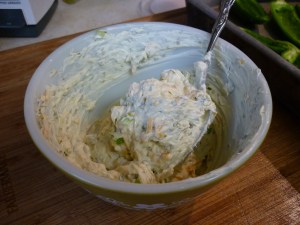 In a small bowl combine 8-oz. container herb and onion cream cheese, 1/4 cup cheddar cheese and 1/4 cup chopped green onion. 
