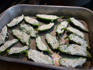 Spoon into the jalapeño halves. 