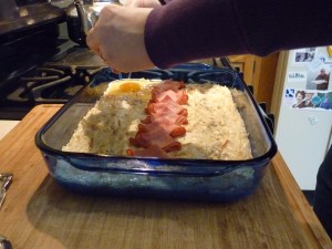 Carefully crack an egg into each indentation.