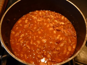 Add tomato sauce. If beans are soupier than you like, boil, uncovered, over high heat until liquid evaporates to suit your taste;