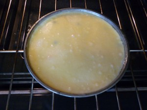 Mix 1 cup sugar, 1 cup flour, 1-1/2 sticks butter (melted & cooled), 2 eggs, and 1 tsp. almond extract in a large bowl until fully combined. Pour batter over fruit in the cake pan. 