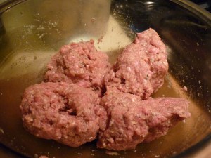 In a mixing bowl beat 1 egg. Add ¼ cup dried bread crumbs, 2 Tbsp. milk, 1 Tbsp. dried minced onion, 2 tsp. dried parsley flakes, ¼ tsp. salt, ¼ tsp. dried majoram, and a dash of pepper. Mix in 1 lb. lean ground beef with your hands and divide into four parts.
