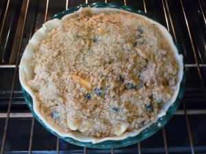 Sprinkle streusel topping over it and place into the oven.