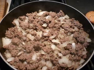 In 1 Tbsp. butter saute 1-lb. ground meat (moose or elk are great!), 2 chopped onions, and 1 minced garlic clove.
