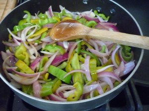 In a bit of olive oil saute together Anaheim peppers, red onion, and garlic until tender. 