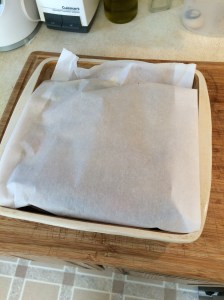 Cover with parchment paper, tucked into the inside, and bake at 375 degrees for 45-50 minutes.