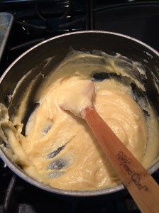 Heat oven to 400 degrees F. In a large saucepan, heat water and butter to rolling boil. Stir in flour. Stir vigorously over low heat about 1 minute or until mixture forms a ball. Remove from heat. Beat in eggs, all at one time; continue beating (I mean REALLY beat it) until smooth. 