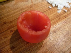 Scoop out the pulp from the tomatoes. I used the pulp to make tomato soup the next day. You won't need the pulp anymore for this dish.