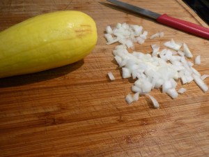 Saute the onion in olive oil until translucent and then add the squash. Saute for a few minutes and then sprinkle in a little parsley, oregano, and basil. Continue sauteing until the squash is soft.