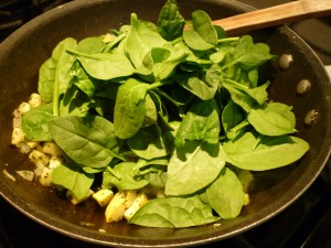 Stir in a couple large handfuls of baby spinach.