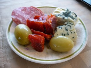 Those aren't grapes, they're green tomato pickles, along with smoked salmon, bleu cheese, and Italian dry salame. What a great snack!